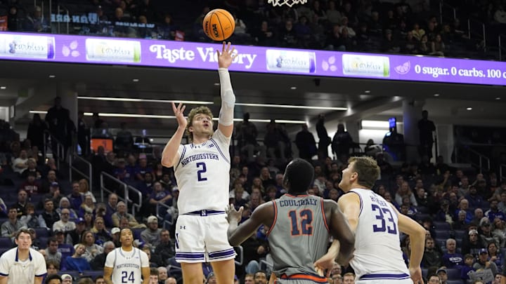 Nov 22, 2024; Evanston, Illinois, USA; Northwestern Wildcats forward Nick Martinelli (2) shoots over Pepperdine Waves forward Boubacar Coulibaly (12) during the second half at Welsh-Ryan Arena. Mandatory Credit: David Banks-Imagn Images