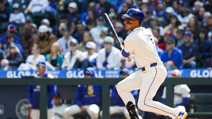 Seattle Mariners designated hitter Jorge Polanco (7) hits a single against the Texas Rangers during the first inning at T-Mobile Park on April 13.