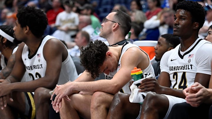 Vanderbilt guard Chris Manon, center, reacts on the bench during a NCAA college basketball first round game against Texas at the men’s Southeastern Conference Tournament Wednesday, March 12, 2025, in Nashville, Tenn. Vanderbilt lost 79-72.