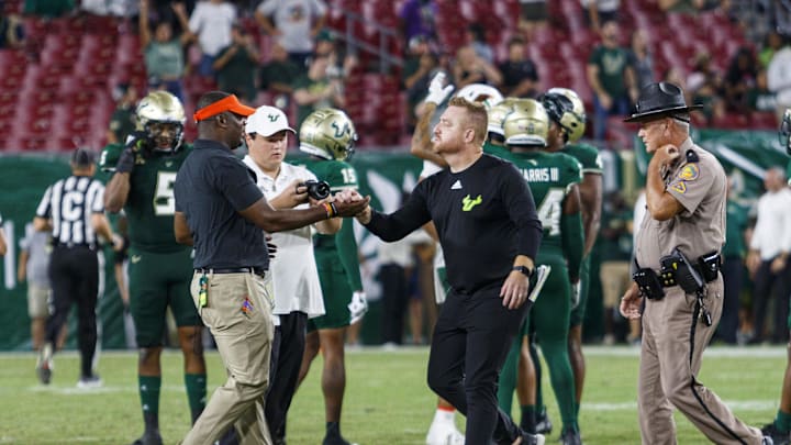 Sep 9, 2023; Tampa, Florida, USA; Florida A&M Rattlers head coach Willie Simmons and South Florida Bulls head coach Alex Golesh shake hands after the game at Raymond James Stadium. Mandatory Credit: Morgan Tencza-USA TODAY Sports