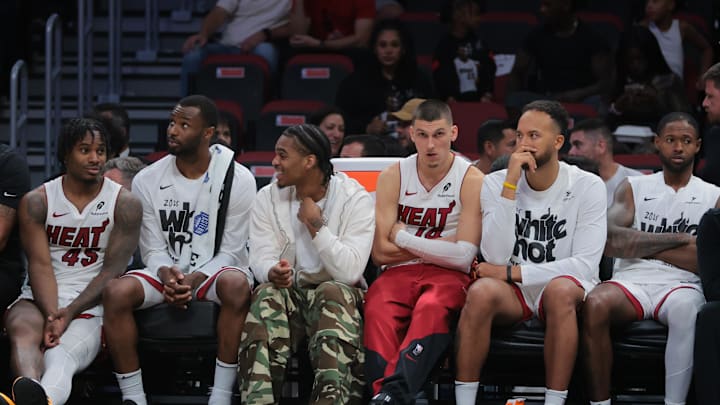 Apr 28, 2025; Miami, Florida, USA; Miami Heat guard Tyler Herro (center) looks on from the bench against the Cleveland Cavaliers in the fourth quarter during game four for the first round of the 2025 NBA Playoffs at Kaseya Center. Mandatory Credit: Sam Navarro-Imagn Images Apr 28, 2025; Miami, Florida, USA; Miami Heat guard Tyler Herro (center) looks on from the bench against the Cleveland Cavaliers in the fourth quarter during game four for the first round of the 2025 NBA Playoffs at Kaseya Center. Mandatory Credit: Sam Navarro-Imagn Images