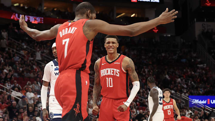 Jan 16, 2026; Houston, Texas, USA; Houston Rockets forward Jabari Smith Jr. (10) reacts to forward Kevin Durant (7) dunk against the Minnesota Timberwolves in the second half at Toyota Center. Mandatory Credit: Thomas Shea-Imagn Images