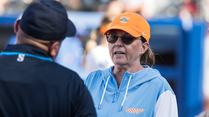May 30, 2025; Oklahoma City, OK, USA; Tennessee Lady Volunteers head coach Karen Weekly talks to an umpire during the first inning against the Florida Gators during the NCAA Softball Women's College World Series at Devon Park. Mandatory Credit: Brett Rojo-Imagn Images