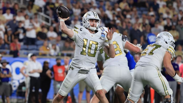 Dec 27, 2025; Orlando, FL, USA; Georgia Tech Yellow Jackets quarterback Haynes King (10) throws the ball against the BYU Cougars during the second half at Camping World Stadium. Mandatory Credit: Kim Klement Neitzel-Imagn Images