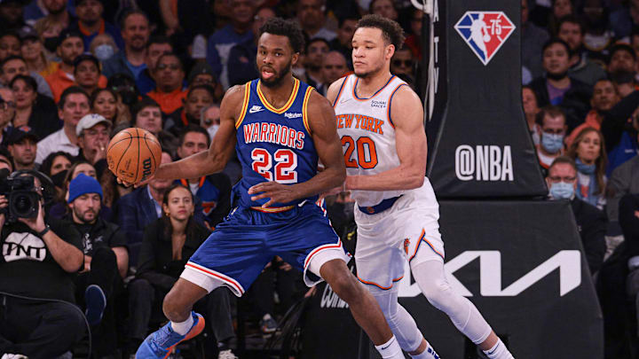 Dec 14, 2021; New York, New York, USA; Golden State Warriors forward Andrew Wiggins (22) controls the ball as New York Knicks forward Kevin Knox II (20) defends during the second half at Madison Square Garden. Mandatory Credit: Vincent Carchietta-Imagn Images