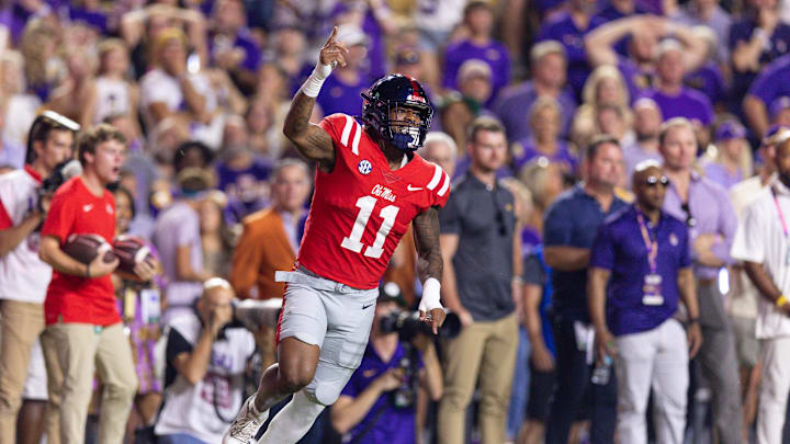 Oct 12, 2024; Baton Rouge, Louisiana, USA;  Mississippi Rebels linebacker Chris Paul Jr. (11) reacts after an interception by defensive tackle Jamarious Brown (not pictured) against the LSU Tigers during the first half at Tiger Stadium. Mandatory Credit: Stephen Lew-Imagn Images