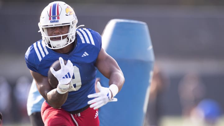 Kansas redshirt senior running back Daniel Hishaw Jr. (9) works through drills during an outdoor practice on Thursday, March 27, 2025.