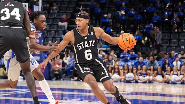 Dec 21, 2024; Memphis, Tennessee, USA; Mississippi State Bulldogs guard Dellquan Warren (6) drives against the Memphis Tigers during the second half at FedExForum. Mandatory Credit: Wesley Hale-Imagn Images
