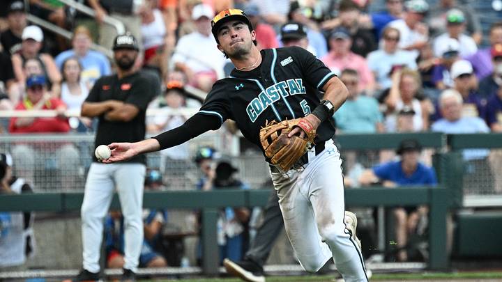 Jun 15, 2025; Omaha, Neb, USA; Coastal Carolina Chanticleers third baseman Walker Mitchell (5) throws to first against the Oregon State Beavers during the fourth inning at Charles Schwab Field. Mandatory Credit: Steven Branscombe-Imagn Images Jun 15, 2025; Omaha, Neb, USA; Coastal Carolina Chanticleers third baseman Walker Mitchell (5) throws to first against the Oregon State Beavers during the fourth inning at Charles Schwab Field. Mandatory Credit: Steven Branscombe-Imagn Images
