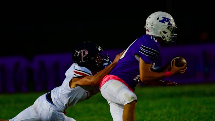 Albany football senior Carter Wesen is brought down during a game against Pierz on Sept. 19, 2025 in Albany. The Huskies lost 21-14.