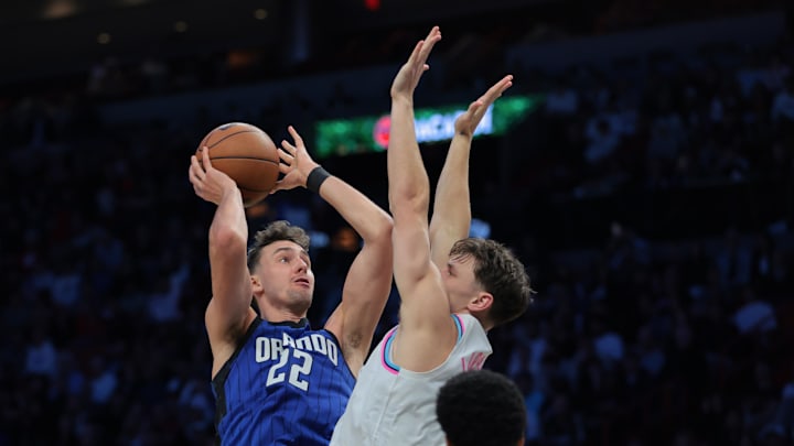 Jan 27, 2025; Miami, Florida, USA; Orlando Magic forward Franz Wagner (22) drives to the basket against Miami Heat guard Pelle Larsson (9) during the third quarter at Kaseya Center. Mandatory Credit: Sam Navarro-Imagn Images Jan 27, 2025; Miami, Florida, USA; Orlando Magic forward Franz Wagner (22) drives to the basket against Miami Heat guard Pelle Larsson (9) during the third quarter at Kaseya Center. Mandatory Credit: Sam Navarro-Imagn Images