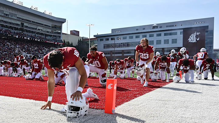 Washington State linebacker Taariq Al-Uqdah (18) says a prayer before facing Colorado State in 2022. Washington State linebacker Taariq Al-Uqdah (18) says a prayer before facing Colorado State in 2022.