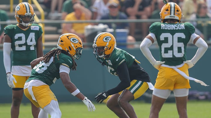Green Bay cornerbacks Gregory Junior (28) and Bo Melton (16) run through a drill during practice on Thursday, July 31, 2025, at Ray Nitschke Field in Ashwaubenon, Wis. 
Tork Mason/USA TODAY NETWORK-Wisconsin