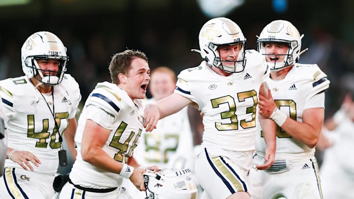 Aug 24, 2024; Dublin, IRL; Georgia Tech place kicker Aidan Birr is congratulated by teammates after scoring the winning field goal against Florida State at Aviva Stadium. Mandatory Credit: Tom Maher/INPHO via USA TODAY Sports
