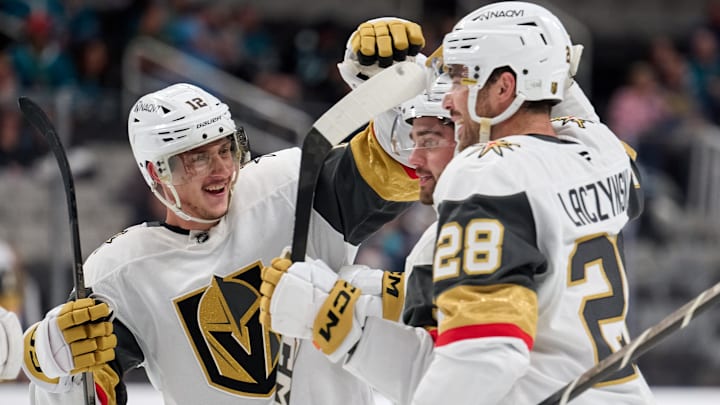Sep 26, 2025; San Jose, California, USA; Vegas Golden Knights defenseman Lukas Cormier (51, center) celebrates with center Jakub Brabenec (12) and center Tanner Laczynski (28) after scoring the game-winning power play goal against the San Jose Sharks during the third period at SAP Center at San Jose. Mandatory Credit: Robert Edwards-Imagn Images
