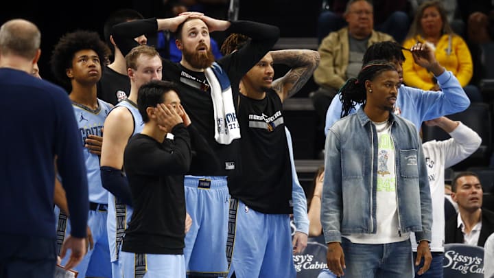 Nov 19, 2024; Memphis, Tennessee, USA; Memphis Grizzlies guard Ja Morant (left) and the Grizzlies bench react during the second half against the Denver Nuggets at FedExForum. Mandatory Credit: Petre Thomas-Imagn Images