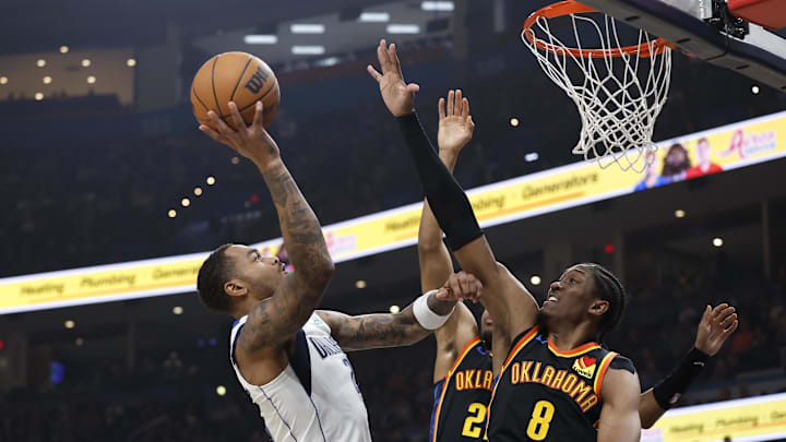 Nov 17, 2024; Oklahoma City, Oklahoma, USA; Oklahoma City Thunder guard Ajay Mitchell (25) shoots as Oklahoma City Thunder forward Jalen Williams (8) defends during the second quarter at Paycom Center. Mandatory Credit: Alonzo Adams-Imagn Images
