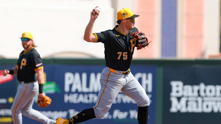 Mar 1, 2026; Jupiter, Florida, USA; Pittsburgh Pirates shortstop Konnor Griffin (75) turns a double play against the St. Louis Cardinals during the second inning at Roger Dean Chevrolet Stadium. Mandatory Credit: Sam Navarro-Imagn Images