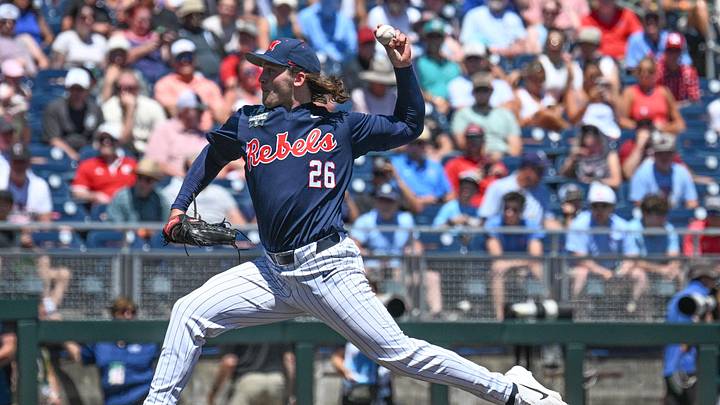 Jun 14, 2026; Omaha, NE, USA; Mississippi Rebels starting pitcher Hunter Elliott (26) throws against the Troy Trojans during the fourth inning at Charles Schwab Field. Mandatory Credit: Steven Branscombe-Imagn Images Jun 14, 2026; Omaha, NE, USA; Mississippi Rebels starting pitcher Hunter Elliott (26) throws against the Troy Trojans during the fourth inning at Charles Schwab Field. Mandatory Credit: Steven Branscombe-Imagn Images
