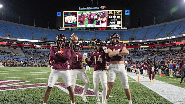 Jan 3, 2025; Charlotte, NC, USA; Virginia Tech Hokies cornerback Dante Lovett (1) and teammates after his late interception during the second half against the Minnesota Golden Gophers at the Duke’s Mayo Bowl at Bank of America Stadium. Mandatory Credit: Jim Dedmon-Imagn Images Jan 3, 2025; Charlotte, NC, USA; Virginia Tech Hokies cornerback Dante Lovett (1) and teammates after his late interception during the second half against the Minnesota Golden Gophers at the Duke’s Mayo Bowl at Bank of America Stadium. Mandatory Credit: Jim Dedmon-Imagn Images
