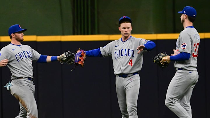 May 3, 2025; Milwaukee, Wisconsin, USA;  Chicago Cubs left fielder Ian Happ (8), center fielder Pete Crow-Armstrong (4) and right fielder Kyle Tucker (30) celebrate after beating the Milwaukee Brewers at American Family Field. 