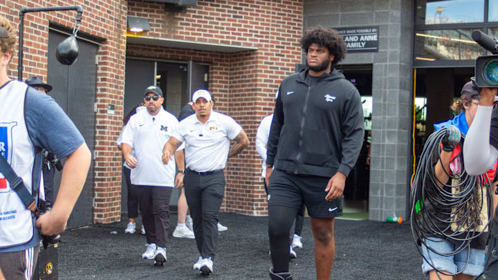 Sept 20, 2025; Columbia, Missouri, USA; Missouri Tigers left tackle Cayden Green exits the locker room in a boot ahead of the Missouri Tigers Week 4 matchup against South Carolina. Sept 20, 2025; Columbia, Missouri, USA; Missouri Tigers left tackle Cayden Green exits the locker room in a boot ahead of the Missouri Tigers Week 4 matchup against South Carolina.