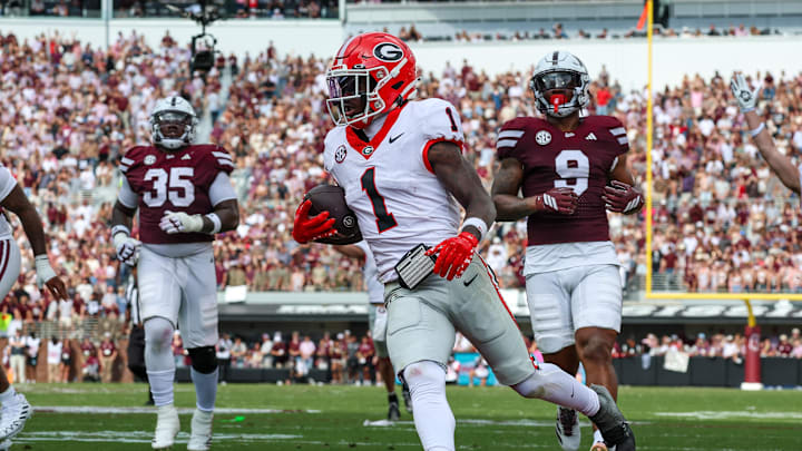 Nov 8, 2025; Starkville, Mississippi, USA; Georgia Bulldogs wide receiver Zachariah Branch (1) runs with the ball for a touchdown against the Mississippi State Bulldogs during the first half at Davis Wade Stadium at Scott Field. Mandatory Credit: Wesley Hale-Imagn Images