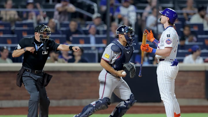 Jun 24, 2025; New York City, New York, USA; New York Mets third baseman Brett Baty (7) reacts as home plate umpire Adam Hamari (78) calls him out on strikes during the ninth inning against the Atlanta Braves at Citi Field. Mandatory Credit: Brad Penner-Imagn Images