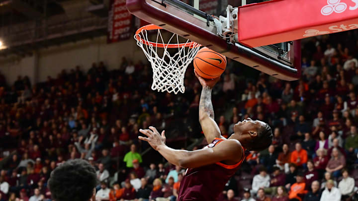 Feb 15, 2025; Blacksburg, Virginia, USA; Virginia Tech Hokies forward Tobi Lawal (1) goes up for a shot against the Virginia Cavaliers during the first half at Cassell Coliseum. Mandatory Credit: Brian Bishop-Imagn Images Feb 15, 2025; Blacksburg, Virginia, USA; Virginia Tech Hokies forward Tobi Lawal (1) goes up for a shot against the Virginia Cavaliers during the first half at Cassell Coliseum. Mandatory Credit: Brian Bishop-Imagn Images