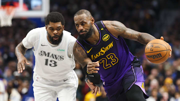 Jan 7, 2025; Dallas, Texas, USA; Los Angeles Lakers forward LeBron James (23) drives to the basket as Dallas Mavericks forward Naji Marshall (13) defends during the second half at American Airlines Center. Mandatory Credit: Kevin Jairaj-Imagn Images Jan 7, 2025; Dallas, Texas, USA; Los Angeles Lakers forward LeBron James (23) drives to the basket as Dallas Mavericks forward Naji Marshall (13) defends during the second half at American Airlines Center. Mandatory Credit: Kevin Jairaj-Imagn Images