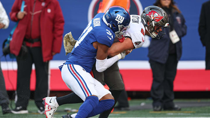 Nov 24, 2024; East Rutherford, New Jersey, USA; Tampa Bay Buccaneers tight end Cade Otton (88) is tackled by New York Giants safety Tyler Nubin (31) during the first half at MetLife Stadium. Nov 24, 2024; East Rutherford, New Jersey, USA; Tampa Bay Buccaneers tight end Cade Otton (88) is tackled by New York Giants safety Tyler Nubin (31) during the first half at MetLife Stadium.
