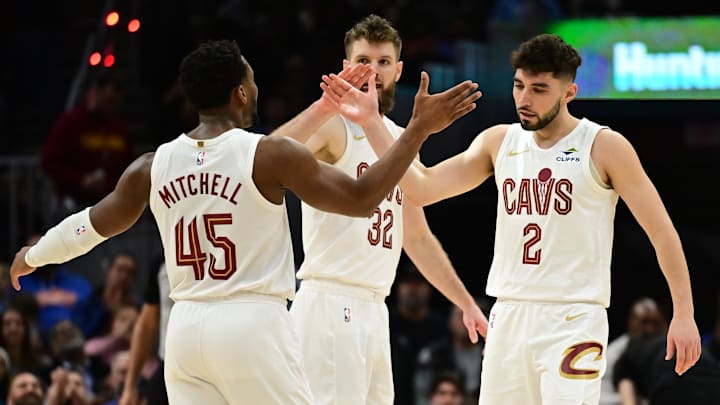 Dec 20, 2024; Cleveland, Ohio, USA; Cleveland Cavaliers guard Ty Jerome (2) celebrates with guard Donovan Mitchell (45) after hitting a three point basket during the first half against the Milwaukee Bucks at Rocket Mortgage FieldHouse. Mandatory Credit: Ken Blaze-Imagn Images