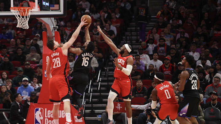 Feb 23, 2026; Houston, Texas, USA;  Utah Jazz guard Elijah Harkless (16) has his shot blocked by Houston Rockets center Alperen Sengun (28) in the fourth quarter at Toyota Center. Mandatory Credit: Thomas Shea-Imagn Images