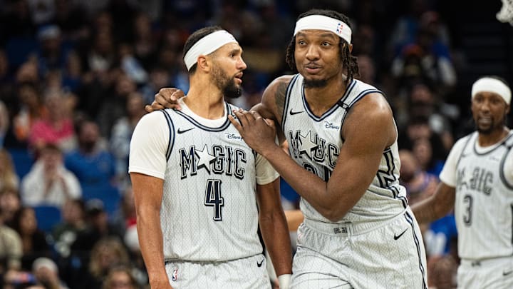 Dec 15, 2024; Orlando, Florida, USA; Orlando Magic forward Wendell Carter Jr. holding back guard Jalen Suggs (4) after a foul against the New York Knicks in the fourth quarter at Kia Center. Mandatory Credit: Jeremy Reper-Imagn Images
