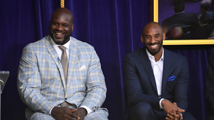 Mar 24, 2017; Los Angeles, CA, USA; Los Angeles Lakers former center Shaquille O'Neal (left) and guard Kobe Bryant react during ceremony to unveil statue of O'Neal at Staples Center. Mandatory Credit: Kirby Lee-Imagn Images