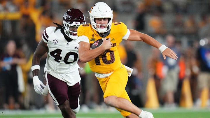 Arizona State quarterback Sam Leavitt (10) scrambles past Mississippi State Bulldogs linebacker Nic Mitchell (40) at Mountain America Stadium on Sept. 7, 2024, in Tempe.