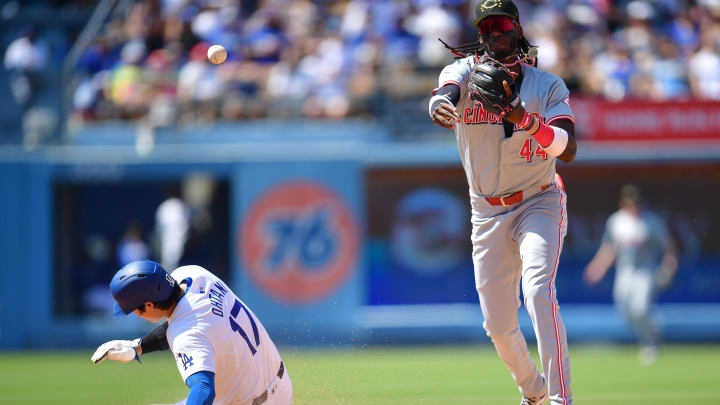 Los Angeles Dodgers designated hitter Shohei Ohtani (17) is out at second as Cincinnati Reds shortstop Elly De La Cruz (44) throws to first for the out against first baseman Freddie Freeman (5) during the eighth inning at Dodger Stadium in May 2024.