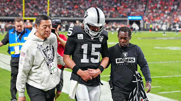 Nov 24, 2024; Paradise, Nevada, USA; Las Vegas Raiders quarterback Gardner Minshew (15) heads for the locker room after sustaining an apparent injury during a play against the Denver Broncos during the fourth quarter at Allegiant Stadium. Mandatory Credit: Stephen R. Sylvanie-Imagn Images