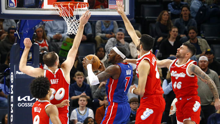 Nov 27, 2024; Memphis, Tennessee, USA; Detroit Pistons forward Paul Reed (7) drives to the basket as Memphis Grizzlies center Jay Huff (30), forward Santi Aldama (7) and guard John Konchar (46) defend during the fourth quarter at FedExForum. Mandatory Credit: Petre Thomas-Imagn Images Nov 27, 2024; Memphis, Tennessee, USA; Detroit Pistons forward Paul Reed (7) drives to the basket as Memphis Grizzlies center Jay Huff (30), forward Santi Aldama (7) and guard John Konchar (46) defend during the fourth quarter at FedExForum. Mandatory Credit: Petre Thomas-Imagn Images