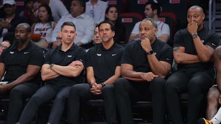 Apr 28, 2025; Miami, Florida, USA; Miami Heat associate head coach Chris Quinn (left), head coach Erik Spoelstra (center), assistant coach Malik Allen and assistant coach Caron Butler (right) look on from the bench against the Cleveland Cavaliers in the fourth quarter during game four for the first round of the 2025 NBA Playoffs at Kaseya Center. Mandatory Credit: Sam Navarro-Imagn Images Apr 28, 2025; Miami, Florida, USA; Miami Heat associate head coach Chris Quinn (left), head coach Erik Spoelstra (center), assistant coach Malik Allen and assistant coach Caron Butler (right) look on from the bench against the Cleveland Cavaliers in the fourth quarter during game four for the first round of the 2025 NBA Playoffs at Kaseya Center. Mandatory Credit: Sam Navarro-Imagn Images