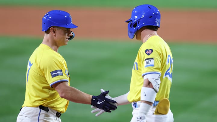 Sep 7, 2024; Boston, Massachusetts, USA; Boston Red Sox right fielder Tyler O'Neill (17) high fives Boston Red Sox second baseman Romy Gonzalez (23) after hitting a two run home run during the first inning against the Chicago White Sox at Fenway Park. Mandatory Credit: Paul Rutherford-Imagn Images