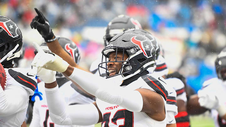 Jan 5, 2025; Nashville, Tennessee, USA; Houston Texans safety Eric Murray (23) celebrates his interception with the crowd against the Tennessee Titans during the first half. at Nissan Stadium. Mandatory Credit: Steve Roberts-Imagn Images Jan 5, 2025; Nashville, Tennessee, USA; Houston Texans safety Eric Murray (23) celebrates his interception with the crowd against the Tennessee Titans during the first half. at Nissan Stadium. Mandatory Credit: Steve Roberts-Imagn Images