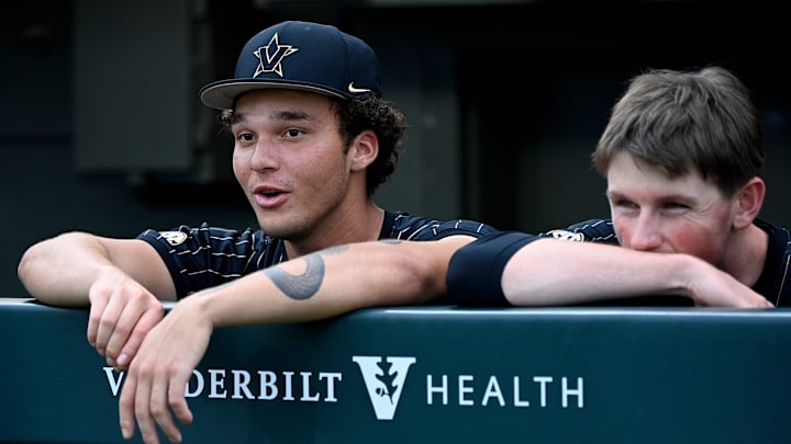 Vanderbilt's Tommy Goodin, left, sits in the dugout before the team’s game against Texas at Hawkins Field on Friday, April 24, 2026, in Nashville, Tenn.