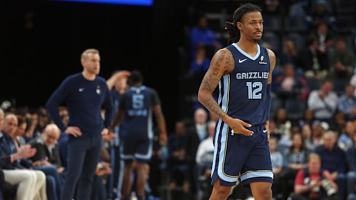 Nov 3, 2025; Memphis, Tennessee, USA; Memphis Grizzlies guard Ja Morant (12) checks into the game during the second quarter against the Detroit Pistons at FedExForum. Mandatory Credit: Petre Thomas-Imagn Images