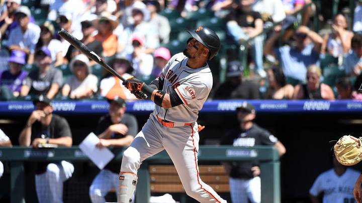 May 31, 2026; Denver, Colorado, USA; San Francisco Giants infielder Luis Arraez (1) hits an RBI sacrifice flyout in the fourth inning against the Colorado Rockies at Coors Field. Mandatory Credit: Christopher Hanewinckel-Imagn Images