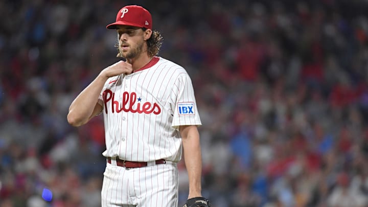 Sep 23, 2024; Philadelphia, Pennsylvania, USA; Philadelphia Phillies pitcher Aaron Nola (27) walks off the field after the fifth inning against the Chicago Cubs at Citizens Bank Park.