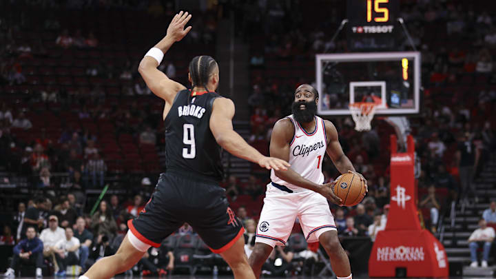 Nov 15, 2024; Houston, Texas, USA; Los Angeles Clippers guard James Harden (1) controls the ball as Houston Rockets forward Dillon Brooks (9) defends during the first half at Toyota Center. Mandatory Credit: Troy Taormina-Imagn Images
