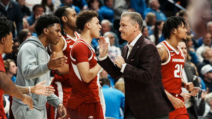 Arkansas head coach John Calipari gives high fives to his team as the Razorbacks took the half time lead over Kentucky Saturday Feb. 1, 2025 at Rupp Arena in Lexington, Kentucky.