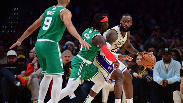Dec 25, 2023; Los Angeles, California, USA; Los Angeles Lakers forward LeBron James (23) moves the ball against Boston Celtics guard Jrue Holiday (4) during the second half at Crypto.com Arena. Mandatory Credit: Gary A. Vasquez-Imagn Images