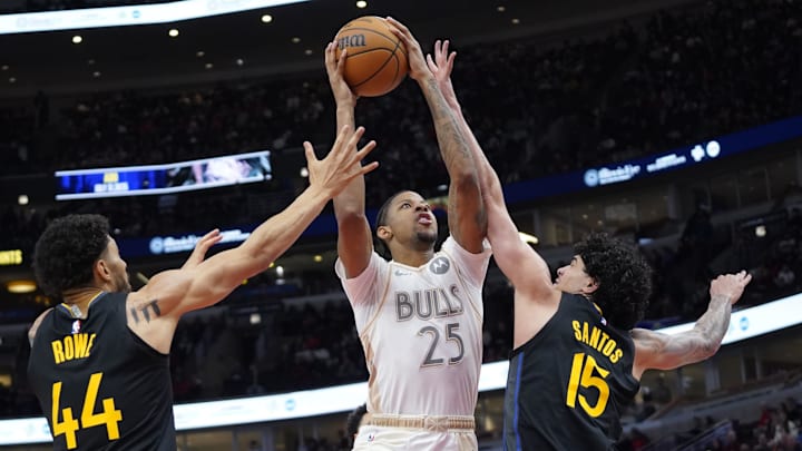 Feb 8, 2025; Chicago, Illinois, USA; Golden State Warriors forward Gui Santos (15) defends Chicago Bulls forward Dalen Terry (25)